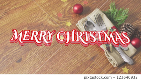 Image of christmas greetings text over cutlery with christmas decorations Image of christmas greetings text over cutlery with christmas decorations 123640932