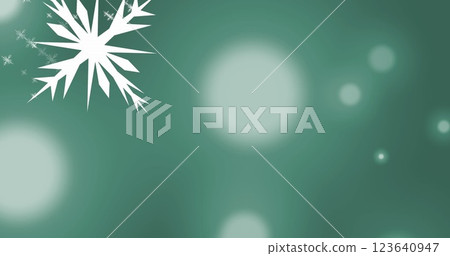 Image of multiple snowflakes icons falling over spots of light against green background 123640947
