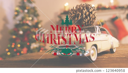 Image of merry christmas text banner against close up of a pine cone on a toy car Image of merry christmas text banner against close up of a pine cone on a toy car 123640958