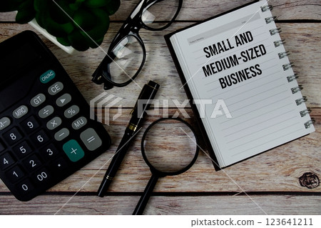Small and Medium-Sized Business (SMB) text on notepad, Business and Financial concept background 123641211