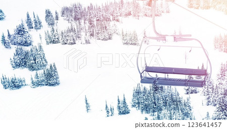 Spot of light over cable car and trees on winter landscape 123641457