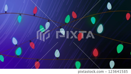 Image of glowing fairy lights over light trails on purple background 123641585