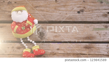 Image of santa claus christmas decoration on wooden surface 123641589