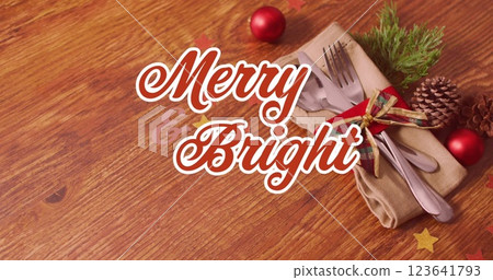 Image of christmas greetings on tag over cupcakes on white background 123641793