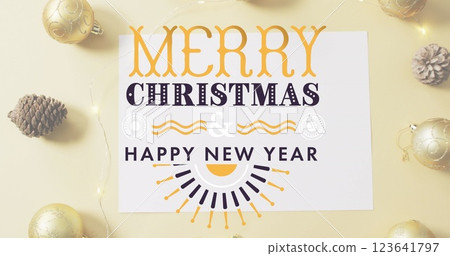 Image of merry christmas text banner against pinecone, bauble and fairy lights on pink surface Image of merry christmas text banner against pinecone, bauble and fairy lights on pink surface 123641797