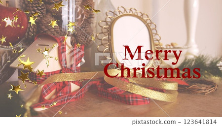 Image of golden stars and merry christmas banner against christmas gifts and decorations Image of golden stars and merry christmas banner against christmas gifts and decorations 123641814