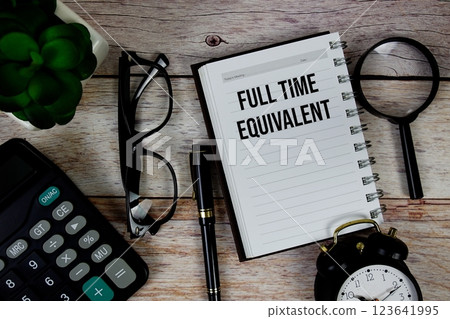 Full Time Equivalent (FTE) text on notepad, Business and Financial concept background 123641995
