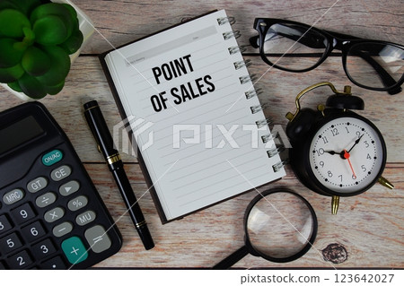 Point Of Sales (POS) text on notepad, Business and Financial concept background 123642027