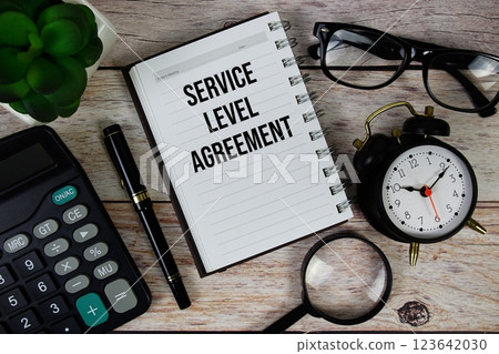 Service Level Agreement (SLA) text on notepad, Business and Financial concept background 123642030