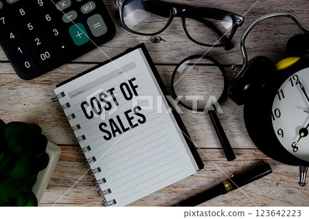 Cost Of Sales (COS) text on notepad, Business and Financial concept background Cost Of Sales (COS) text on notepad, Business and Financial concept background 123642223