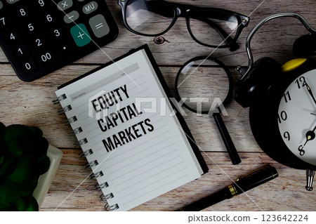 Equity Capital Markets (ECM) text on notepad, Business and Financial concept background 123642224