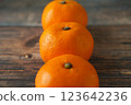 Tangerines on a wooden table 123642236