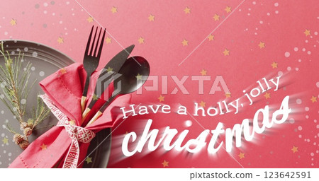 Image of christmas greetings text over christmas place setting and decorations 123642591