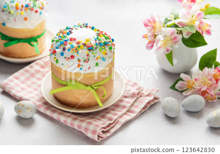 Traditional easter cakes decorated with colorful sprinkles and eggs on festive table 123642830