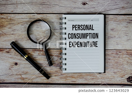 Personal Consumption Expenditure (PCE) text on notepad, Business and Financial concept background 123643029