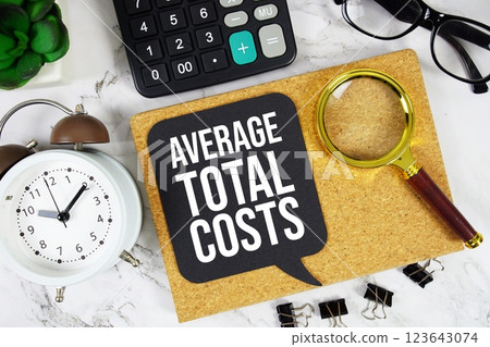 Average Total Costs text on speech bubble with alarm clock, calculator and magnifying glass on marble background Average Total Costs text on speech bubble with alarm clock, calculator and magnifying glass on marble background 123643074