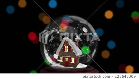 Image of christmas snow globe with house over black background 123643309