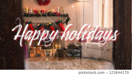 Image of happy holidays text over snow falling with christmas decorations 123644170