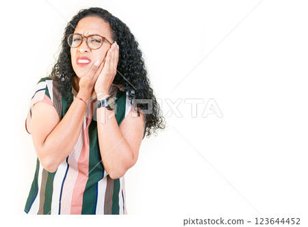 Young afro woman suffering with toothache isolated. Afro girl rubbing cheek with toothache on white background 123644452