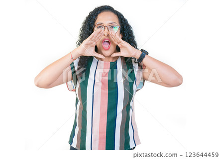 Afro woman screaming and announcing at the camera. Afro girl in glasses announcing something to the camera 123644459
