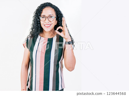 Positive afro woman showing ok gesture isolated. Smiling afro girl gesturing ok approved isolated Positive afro woman showing ok gesture isolated. Smiling afro girl gesturing ok approved isolated 123644568