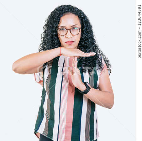 Afro girl gesturing time out isolated. Young afro woman gesturing time out with palms hands isolated 123644591