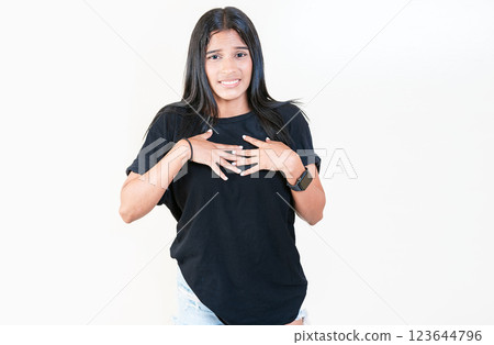 Girl with disgust face isolated. Latin girl with expression of disgust isolated. People with face disgusted on isolated background. 123644796