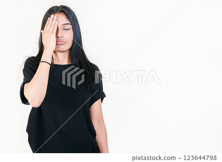 Exhausted people with palm on forehead isolated. Tired and exhausted young girl holding her forehead. Worried young woman holding his forehead 123644798