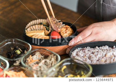 A woman packing lunch in the kitchen (Beloved Wife's Lunch Box) 123644971