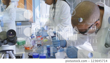 Image of financial data processing over diverse scientists working in lab 123645714