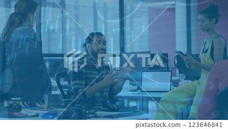 Image of financial data processing over diverse business people in office Image of financial data processing over diverse business people in office 123646841