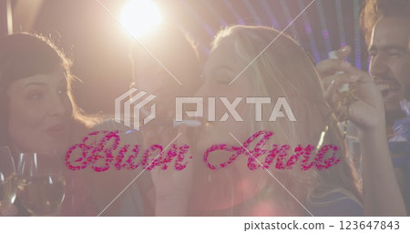 Image of buon anno text in pink over balloons and crowd of celebrating people partying Image of buon anno text in pink over balloons and crowd of celebrating people partying 123647843