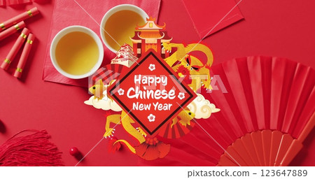Image of new year greetings text over chinese traditional decorations on red background 123647889