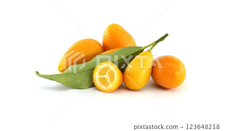 Fresh kumquats with leaves and a half kumquat showing the pulp Fresh kumquats with leaves and a half kumquat showing the pulp 123648218