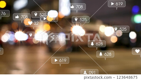 Image of social media icons with growing numbers over cars on city street 123648675
