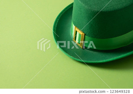St Patricks day and March 17 concept with green parade Leprechaun Hat with belt on green background. Close up. Copy space. St Patricks day and March 17 concept with green parade Leprechaun Hat with belt on green background. Close up. Copy space. 123649328