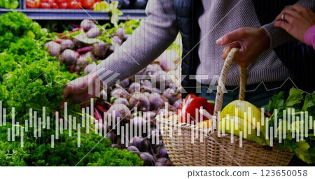 Image of data processing on diagram over caucasian man picking vegetables Image of data processing on diagram over caucasian man picking vegetables 123650058