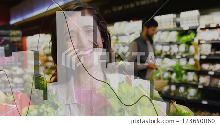 Image of data processing on diagram over caucasian woman picking vegetables in shop Image of data processing on diagram over caucasian woman picking vegetables in shop 123650060