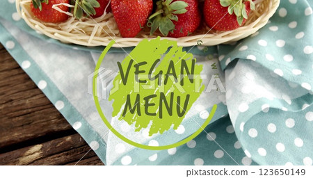 Image of vegan menu text over strawberries on table Image of vegan menu text over strawberries on table 123650149