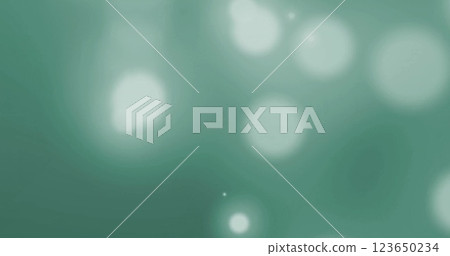 Image of glowing light spots over green background Image of glowing light spots over green background 123650234