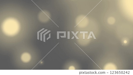 Image of glowing light spots moving over black background 123650242