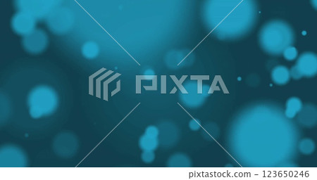 Image of glowing light spots over blue background 123650246