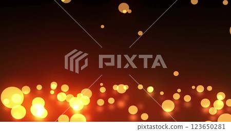 Image of glowing light spots moving over black background 123650281
