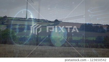 Wind turbine and landscape with renewable energy image over digital interface 123650542
