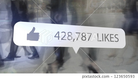 Image of social media like notification over sped up legs of commuters crossing street 123650593