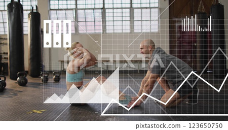 Image of media icons and data over caucasian male instructor and woman training at gym 123650750