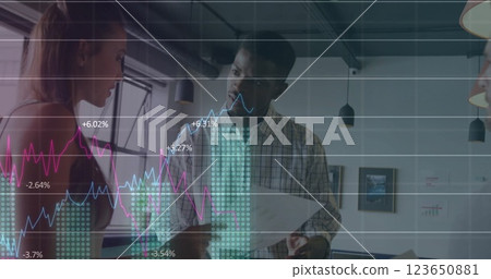 Image of data processing and diagrams over diverse colleagues discussing work in office 123650881