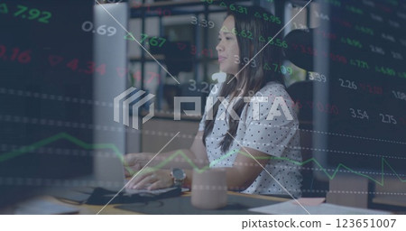 Image of currency icons and data processing over biracial businesswoman in office 123651007
