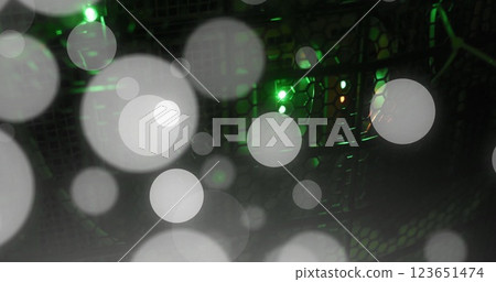 Image of glowing light spots over computer servers Image of glowing light spots over computer servers 123651474