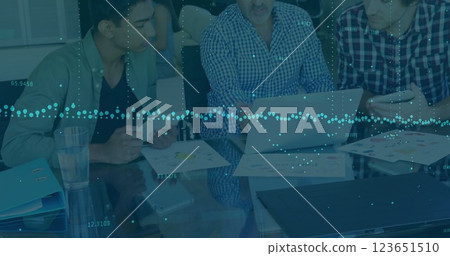 Image of financial data processing over diverse business people in office Image of financial data processing over diverse business people in office 123651510
